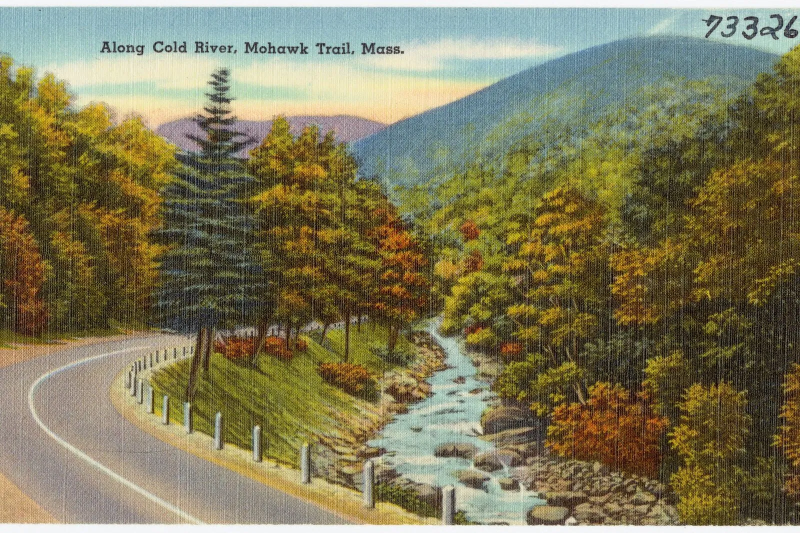 A vintage linen-texture postcard showing the Cold River winding through the Mohawk Trail State Forest gorge — the curving two-lane road of Route 2 in the lower left with a white guardrail, a line of evergreens and autumn-tinted hardwoods rising on the riverbank, the rocky shallow river running over boulders down the center, more wooded slopes climbing on the right, and the rounded blue silhouette of a Berkshire ridge on the far horizon under a pale sky.